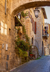 Beautiful the ancient street of the famous Orvieto, a medieval town on a hill, rising above the...