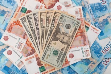 One US Dollar on Russian ruble. Money background. Currency exhange. Economic crisis. Rouble dollar cash. Hundred dollar bill and 5000 rubles. Business and finance. Russia and USA