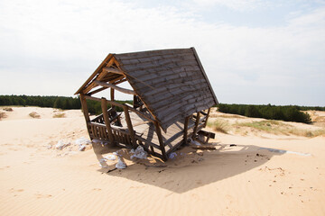 Wooden house destroyed by a sandstorm.