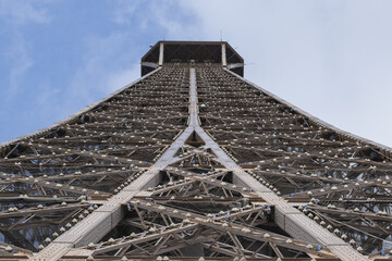 Paris, France: view from below of The Eiffel Tower, metal tower completed in 1889 by Gustave Eiffel...