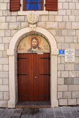 Fototapeta na wymiar Wooden door of stone house in Cetinje, Montenegro