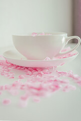 Fototapeta na wymiar cup of tea with pink flowers