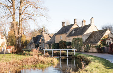 Fototapeta na wymiar Lower Slaughter In The Cotswolds, England in the afternoon winter sunshine