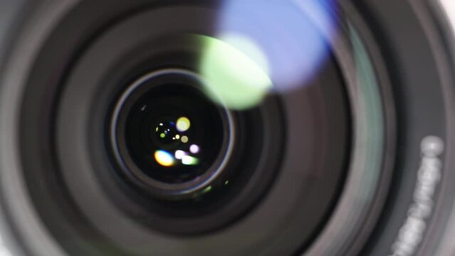 Macro Shot of Camera Lens with Flare on Optical Glass. Process of Zooming Camera Lens