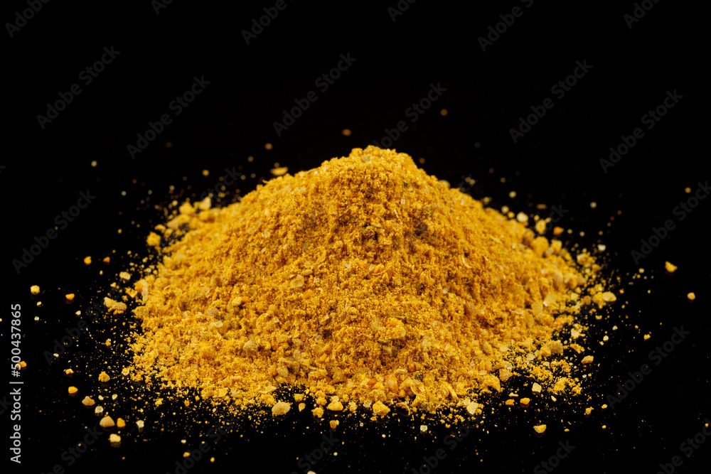 Wall mural Curry powder seasoning black background