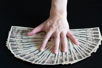Hand on money