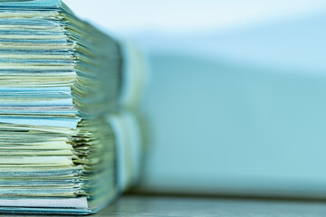 Close up stacks of US Dollar bill money. Copy space for design.