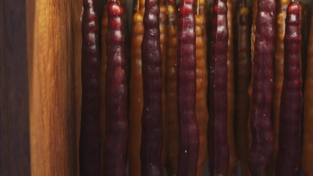 Churchkhela, georgian traditional food in grocery store. Industry of selling products