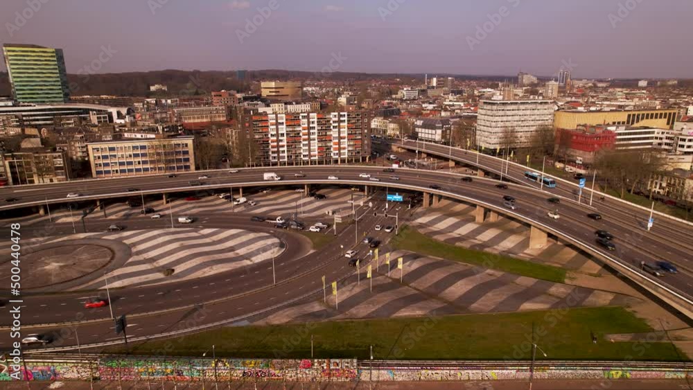 Poster aerial approach of large overpass intersection crossroad with traffic passing by on highway intersec
