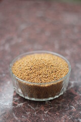 Closeup mustard seeds in a glass bowl