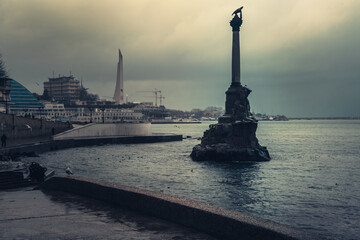 Monument to sunken ships in Black sea water in cloudy day. Sevastopol, Crimea