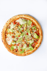 Big pizza with greens. On a white background.
