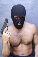 Shirtless muscular robber wearing just a balaclava