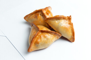 Traditional meat pies. Echpochmak. on a white background. © Игорь Соколов