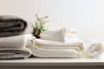 Clothes cleaning service with bedding on bench and isolated background