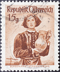 Austria - circa 1948: a postage stamp from Austria, showing a woman with traditional provincial...