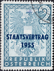 Austria - circa 1955: a postage stamp from Austria, showing the national coat of arms of Austria....