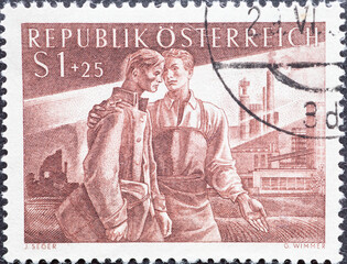 Austria - circa 1955: a postage stamp from Austria, showing town Man returning home & industrial...