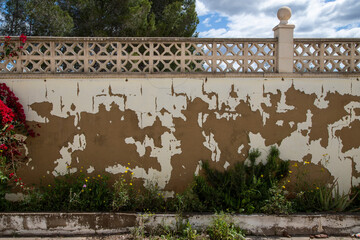 wall with planter deteriorated by time before being repaired