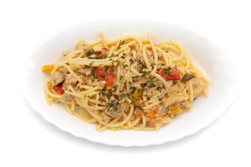 Spaghetti carbonara on a long white plate, isolated on white background. Carbonara is an Italian pasta dish originating from Lazio, and more specifically from Rome.