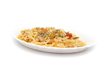 Spaghetti carbonara on a long white plate, isolated on white background. Carbonara is an Italian pasta dish originating from Lazio, and more specifically from Rome.