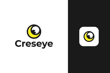 crescent and eyeball outlined logo design vector