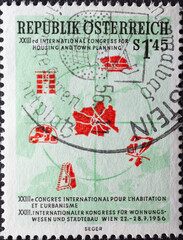 Austria - circa 1956: a postage stamp from Austria, showing a world map with parts of buildings and city plans. International Congress for Housing and Town Planning