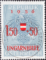 Austria - circa 1956: a postage stamp from Austria, showing the coat of arms of the republick Austria with overprint: Relief for Hungarian Refugees