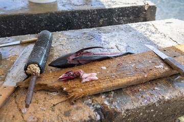 
Gutting table made of stone and tools for processing fresh fish at Playa Grandi (Playa Piscado) on the Caribbean island Curacao