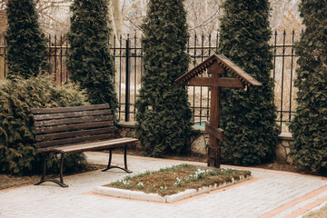 wooden cross on the grave