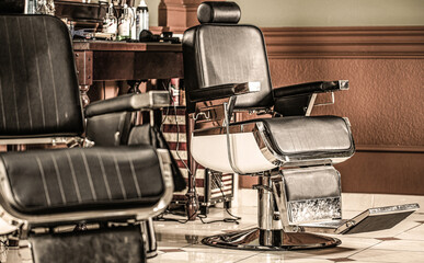 Stylish vintage barber chair. Professional hairstylist in barbershop interior. Barber shop chair....