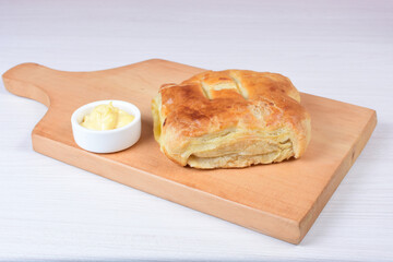 Puff pastry cheese and pineapple cake on wooden background