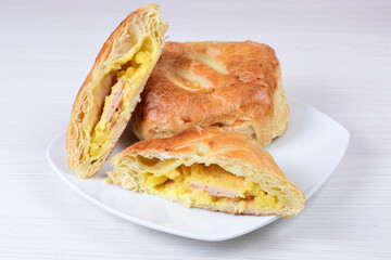 Puff pastry cheese and pineapple cake on wooden background