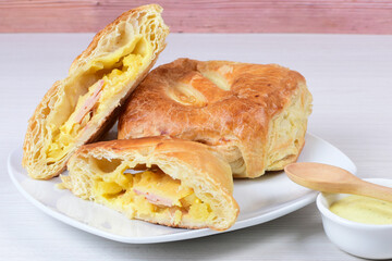 Puff pastry cheese and pineapple cake on wooden background