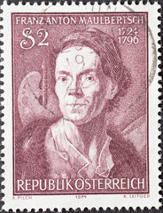 Austria - circa 1974: a postage stamp from Austria, showing a portrait of the late baroque painter Franz Anton Maulbertsch for his 250th birthday