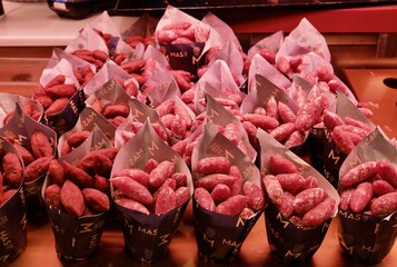 Obraz premium Top view of little sausages in bags at Mercado de San Miguel in Madrid, Spain.