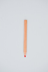 Single isolated small wooden drawing pencil, for student and children on white background