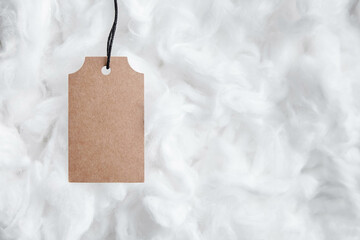 Label tag mockup on white cotton background