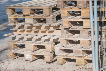 many stacked wooden pallets