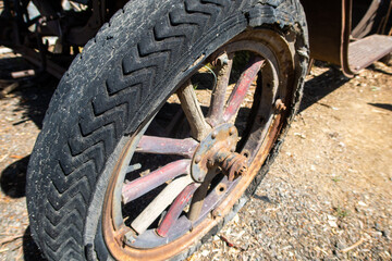A Vintage Truck Wheel from an Antique Vehicle