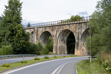 Old railway arch bridge. Panorama.