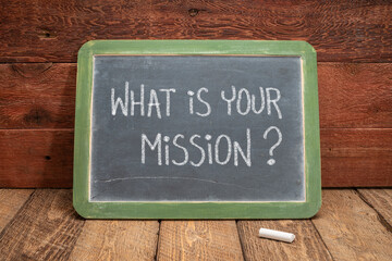 what is your mission question - white chalk handwriting on a slate blackboard, leadership and business concept