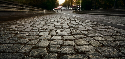 gray stone road surface, cobbled road, cobble background. texture old stone pavement in the city