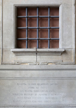 Florence, FI, Italy - August 20, 2015: Hospital of the Innocents known in Tuscan dialect as spedale degli Innocenti detail of windows of the wheel of orphans