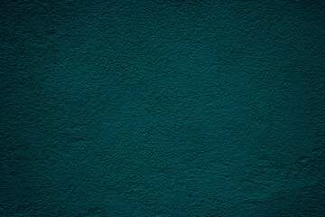 Petrol colored wall background with textures of different shades of teal