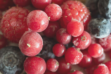 macro photo of frozen strawberries, raspberries and currants