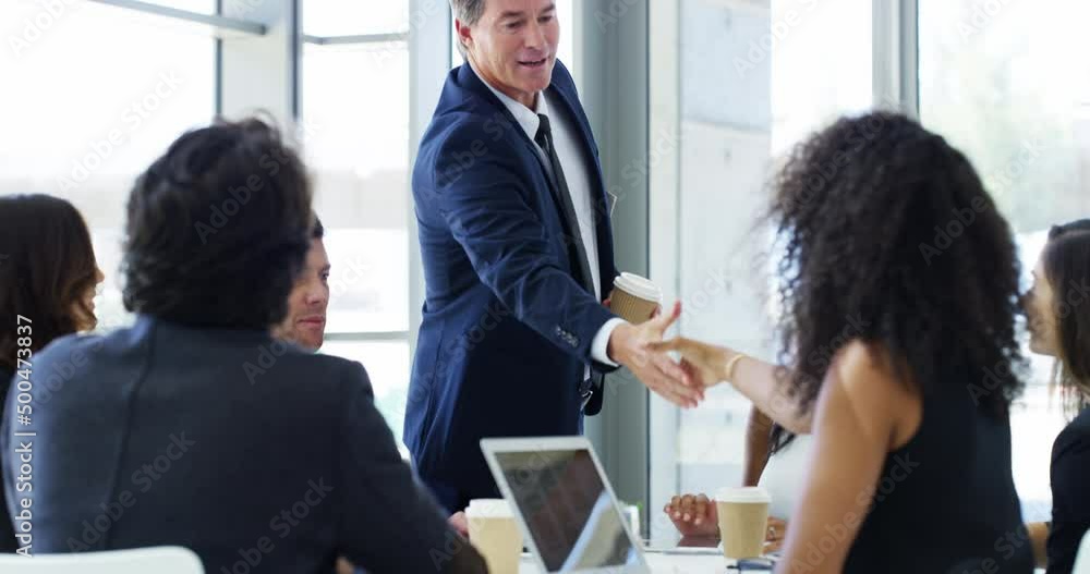 Sticker The boss is here to show them how business is done. 4k video footage of a businessman shaking hands with colleagues before giving a presentation in an office.