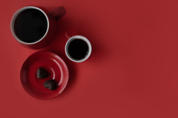 Red coffee mugs with two heart chocolate