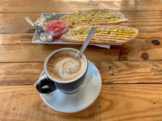 View of Mediterranean breakfast on a table of wooden pallet boards