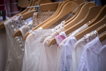 Closeup of boho style clothes on hangers at the market